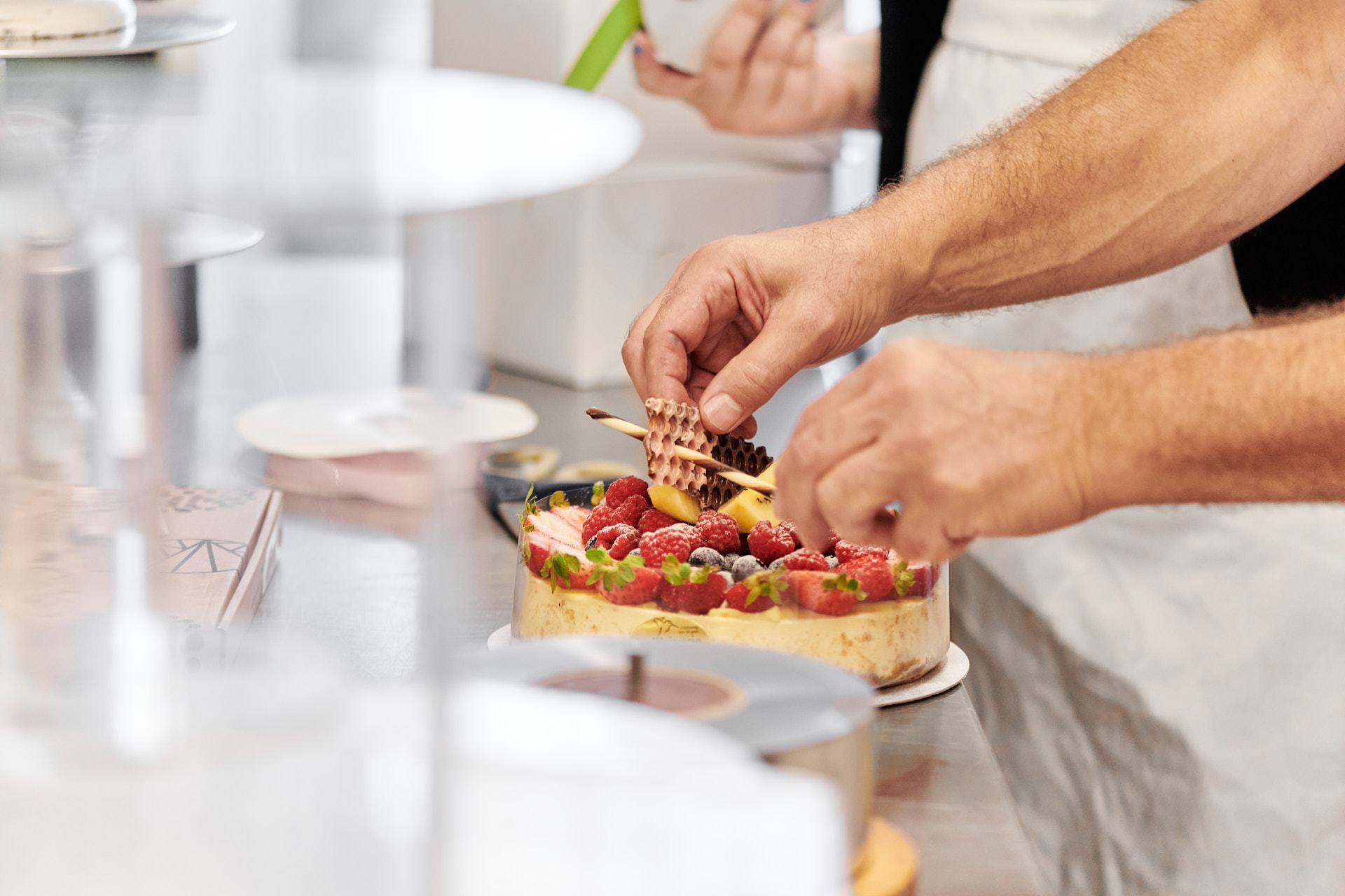 Baker preparing cake